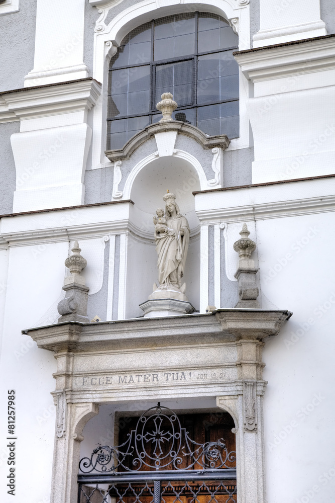 Statue of Virgin Mary. Decoration element of house in old city. 