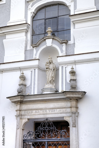 Statue of Virgin Mary. Decoration element of house in old city. 