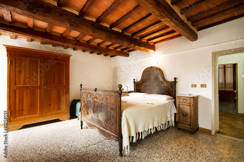 Bedroom with rustic wooden bed