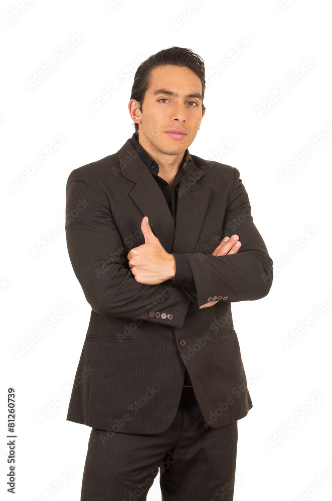 handsome young man wearing a suit posing with thumb up handsome young man wearing a suit posing with thumb up