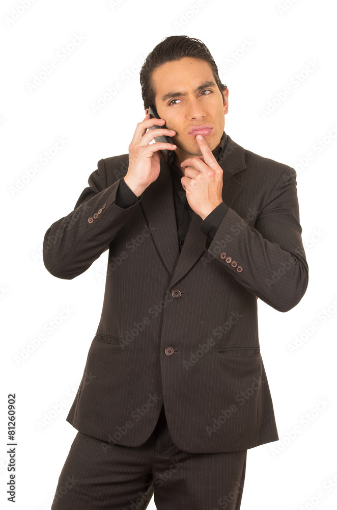 handsome young man wearing a suit posing using cell phone mobile handsome young man wearing a suit posing using cell phone mobile