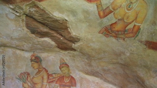 SIGIRIYA, SRI LANKA - FEBRUARY 2014: Wall drawing Frescos in Sigiriya, an ancient palace located in the central Matale District. photo