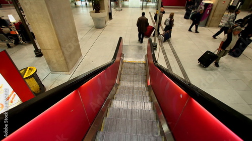 PARIS - OCTOBER 11. Escalator descending to trains in Charles De Gaulle airport on October 11, 2012 in Paris, France. In 2011, the airport handled 60,970,551 passengers and 514,059 aircraft. photo