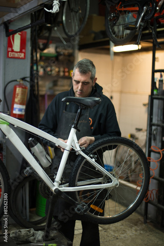 man repairing a bike
