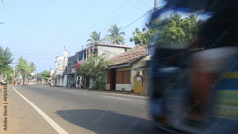 HIKKADUWA, SRI LANKA - FEBRUARY 2014: View of local traffic in Hikkaduwa. Hikkaduwa is a small town on the south coast of Sri Lanka located in the Southern Province. HIKKADUWA, SRI LANKA - FEBRUARY 2014: View of local traffic in Hikkaduwa. Hikkaduwa is a small town on the south coast of Sri Lanka located in the Southern Province.