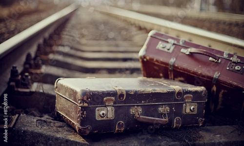 Old suitcases on rails photo