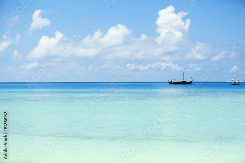 View of beautiful blue ocean water with ship in resort © Africa Studio
