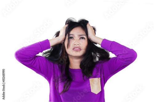 Frustrated girl holding her head