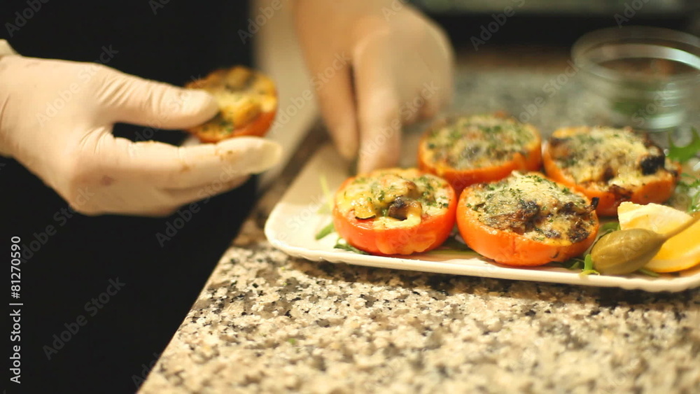 Stuffed tomatoes placed on a plate in restaurant Stuffed tomatoes placed on a plate in restaurant