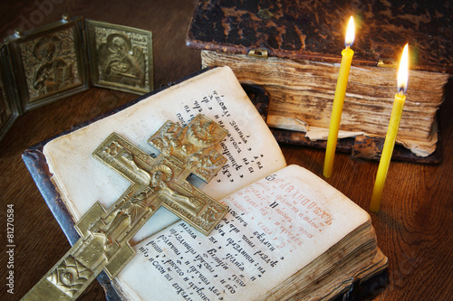 Orthodox Christian still life with metal crucifixion and book photo