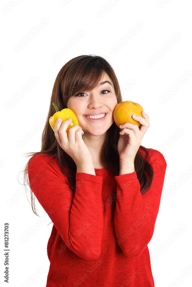 Asian girl pressing fruits and vegetable against her face Asian girl pressing fruits and vegetable against her face