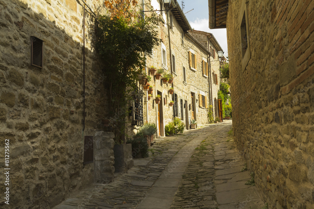 Narrow street in an old town from Tuscany