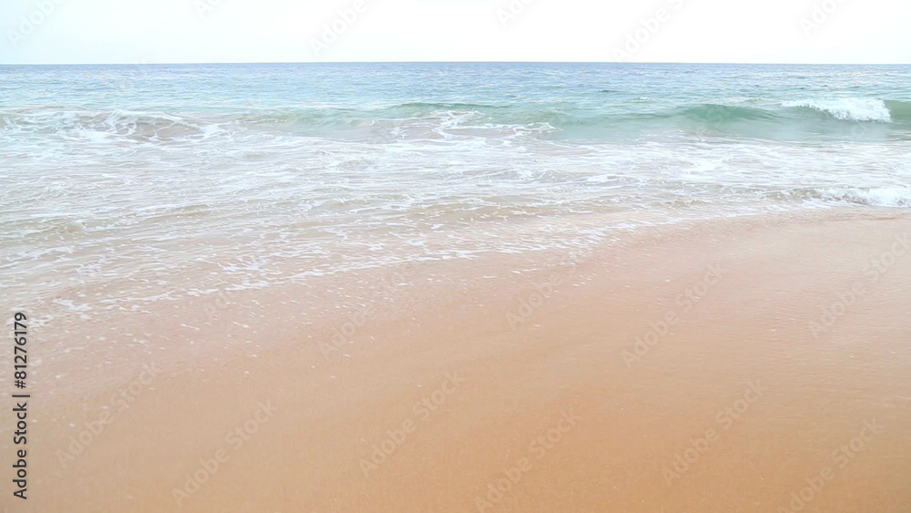 Waves washing over white sand in the tropics Waves washing over white sand in the tropics