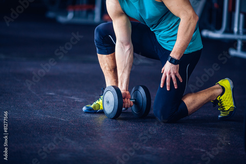 Crossfit instructor at the gym doing Exercise