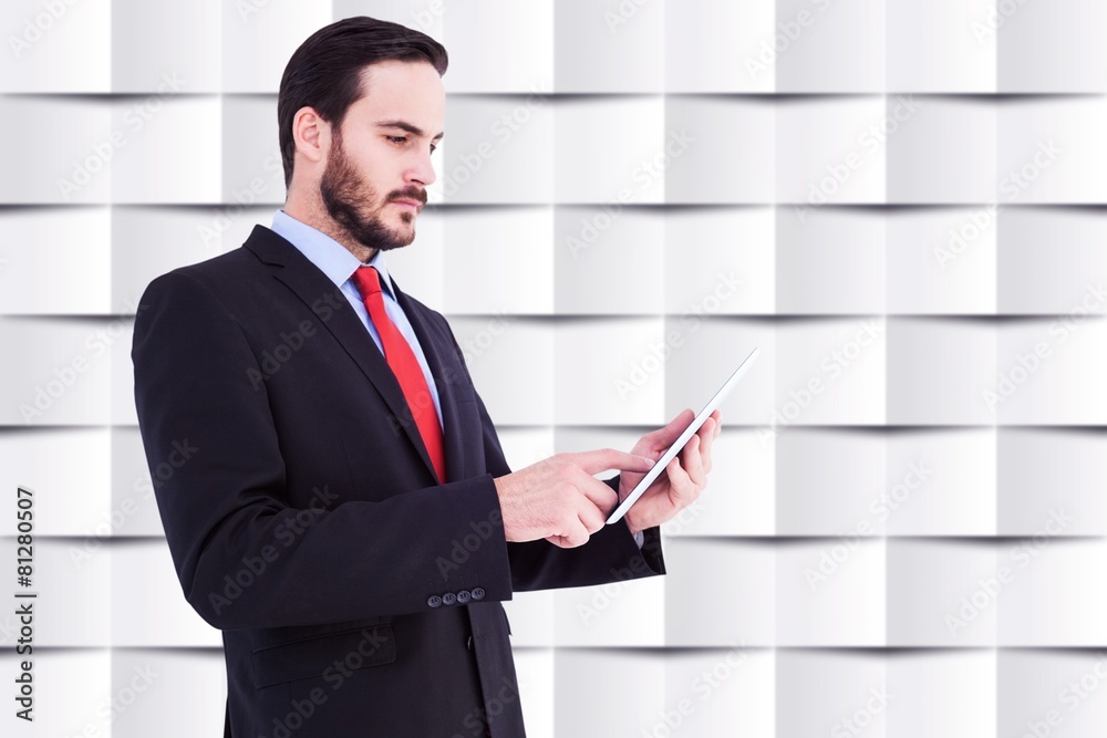 Composite image of businessman scrolling on his digital tablet Composite image of businessman scrolling on his digital tablet