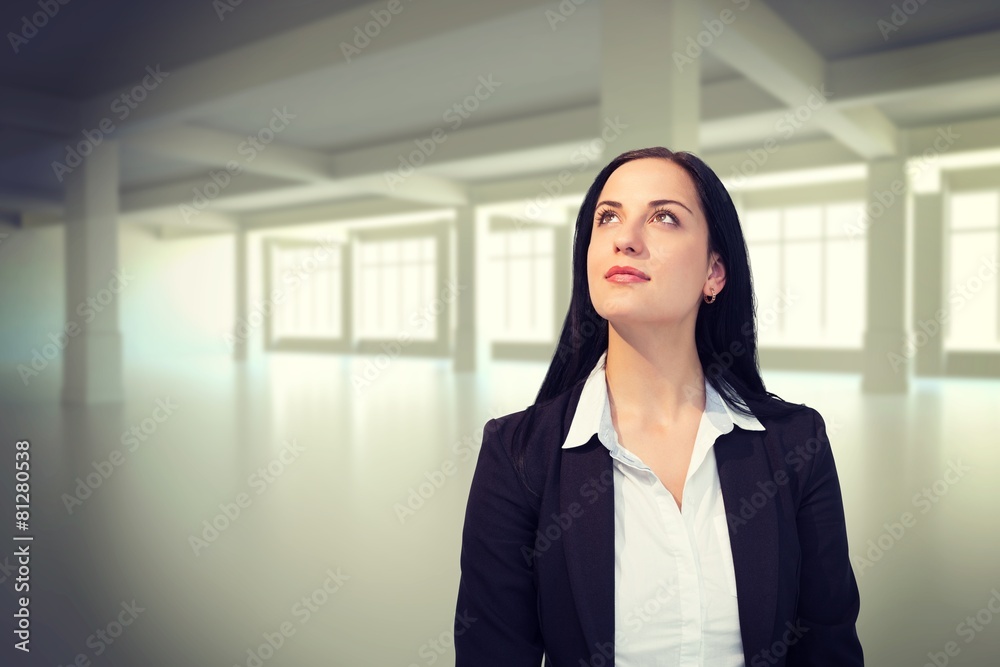 Composite image of pretty businesswoman looking up Composite image of pretty businesswoman looking up