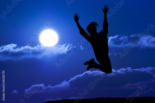 Happy girl woman jump against beautiful sunset. Freedom