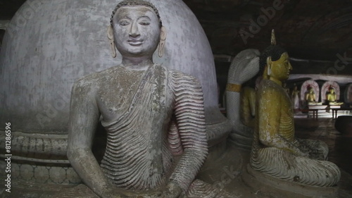 DAMBULLA, SRI LANKA - FEBRUARY 2014: Sitting Buddhas at the Golden Temple of Dambulla. The Golden Temple of Dambulla is a World Heritage Site in Sri Lanka.
