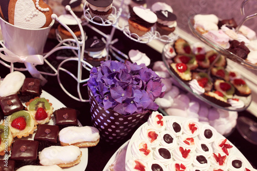 Mix of wedding sweets on table