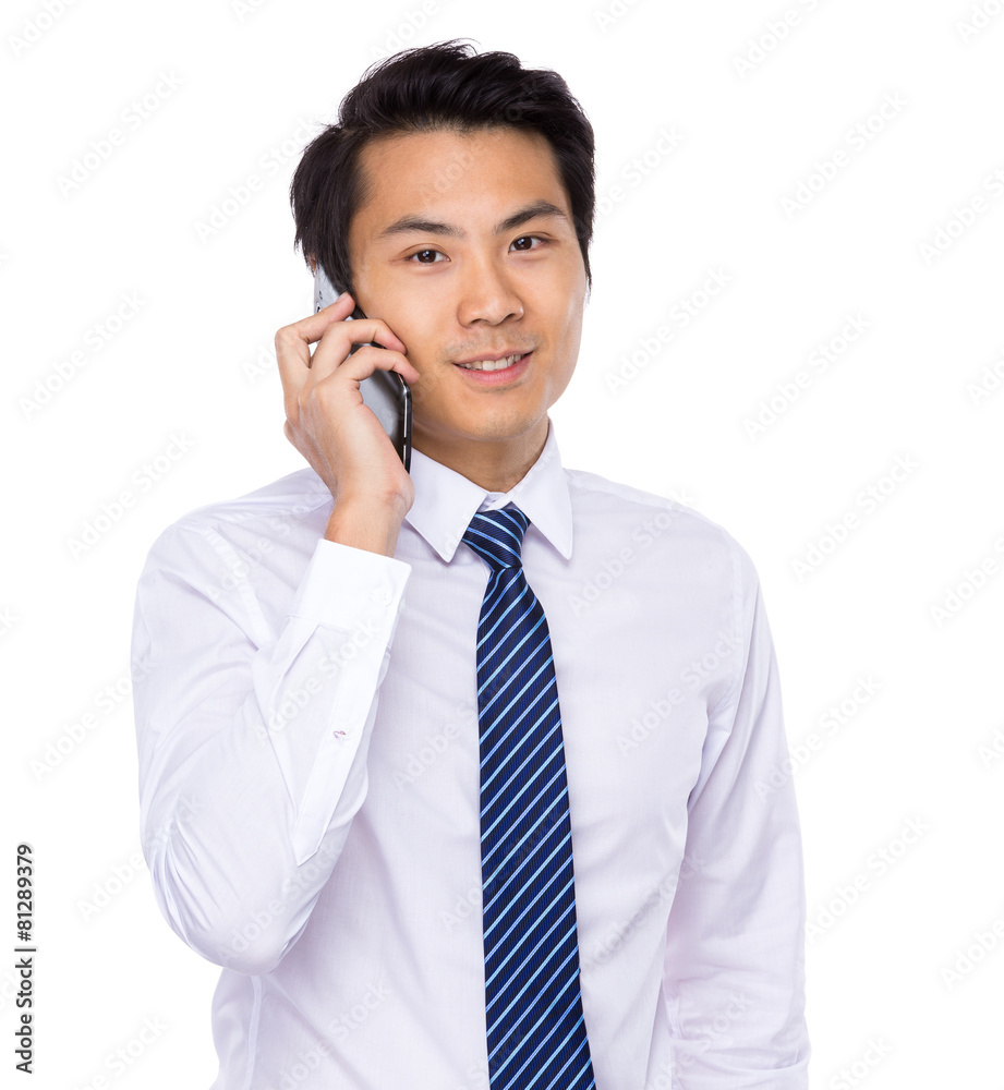 Young asian business man talking on mobile Young asian business man talking on mobile