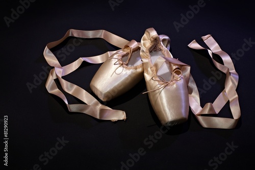 Close-up photo of pink ballet slippers