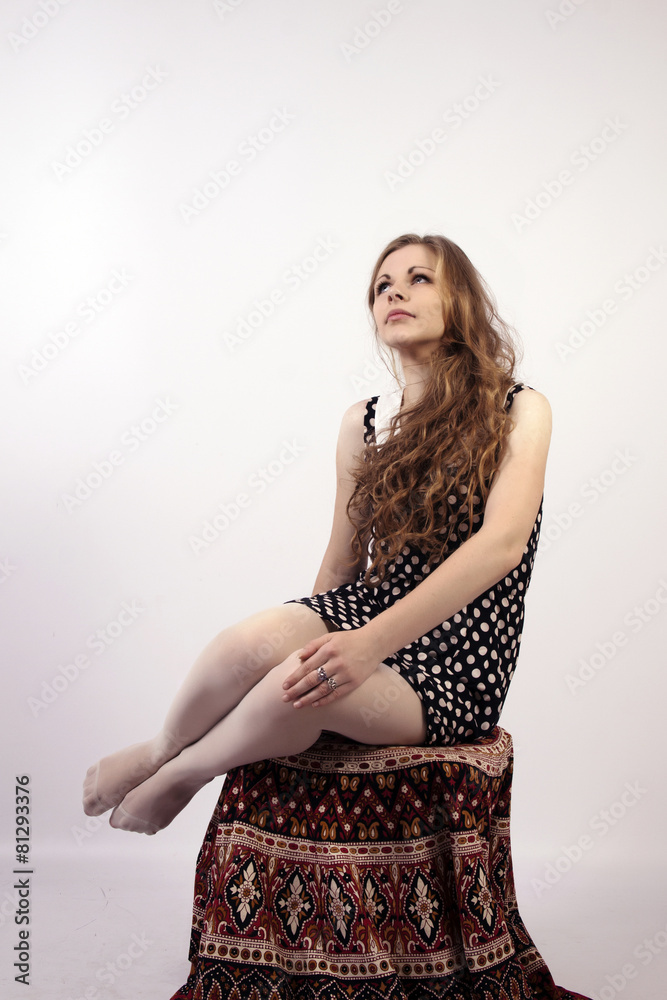 Fototapeta premium Young long-haired curly blonde woman