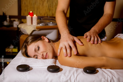 masseur doing massage beautiful girl