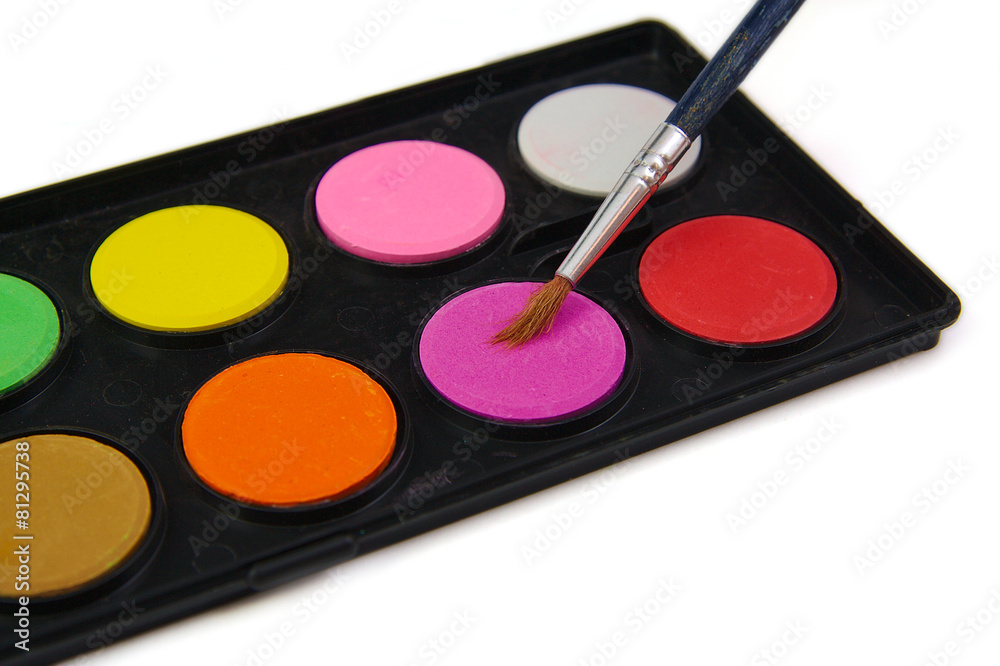 Watercolor paint and brush in black box on a white background Watercolor paint and brush in black box on a white background