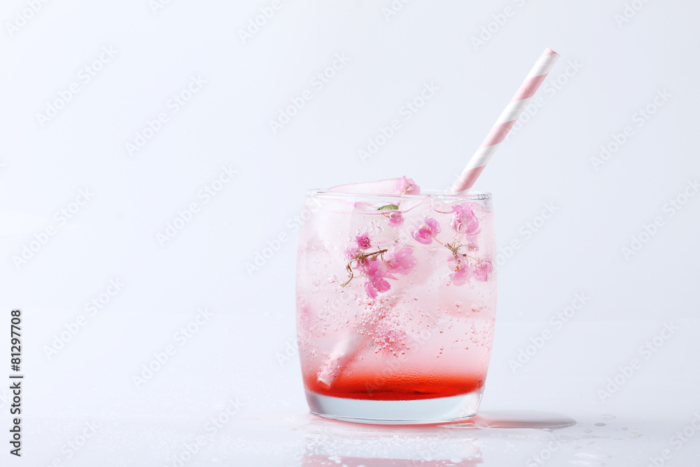 Fresh pink flower frozen in ice cubes for summer drinks Fresh pink flower frozen in ice cubes for summer drinks