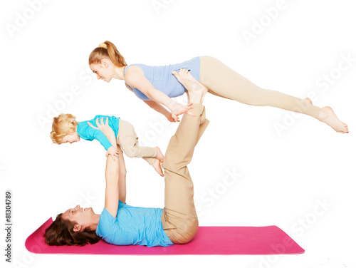 mother, father and son doing yoga