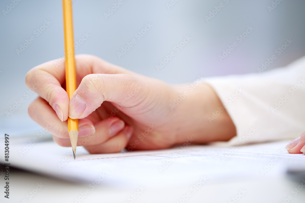 Female hand writing, close up Female hand writing, close up