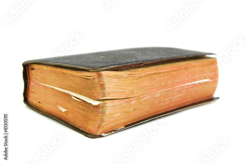 Old book with slightly unfocused back on a white background