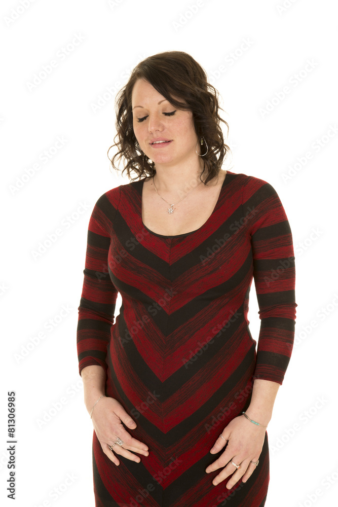 pregnant woman with eyes closed in red and black dress pregnant woman with eyes closed in red and black dress