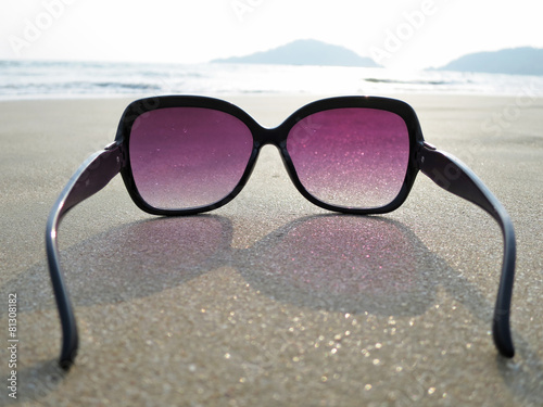 Fototapeta Naklejka Na Ścianę i Meble -  Sunglasses on the sand of Palolem beach. South Goa, India
