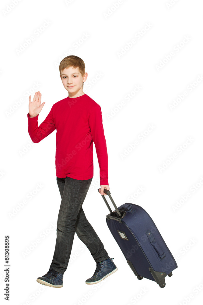 Boy walking and waving hello holding travel bag Boy walking and waving hello holding travel bag