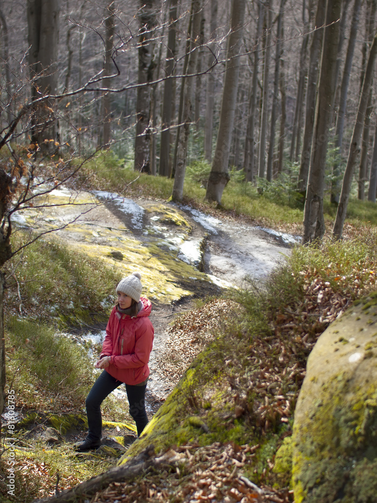 Girl walking in the forest.