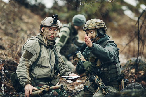 soldiers on the Outdoor of looking at the map