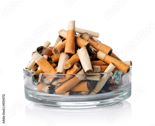 Cigarette butts in the ashtray on white photo