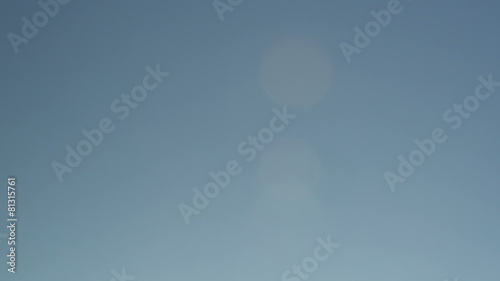 Two players jump at a basketball tip off photo