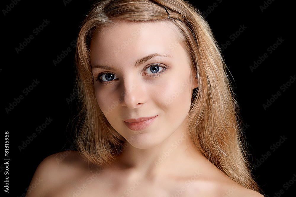 blonde woman's beauty portrait, dark background blonde woman's beauty portrait, dark background