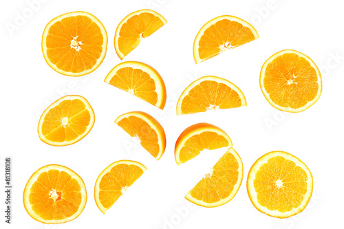 Juicy slices of orange isolated on white photo