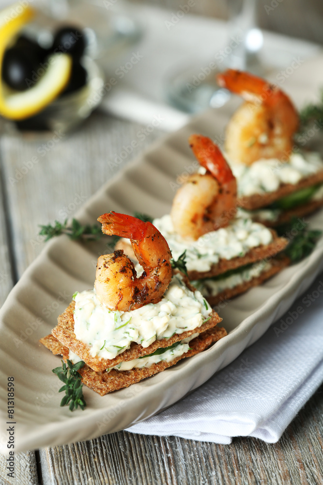 Appetizer canape with shrimp and cucumber