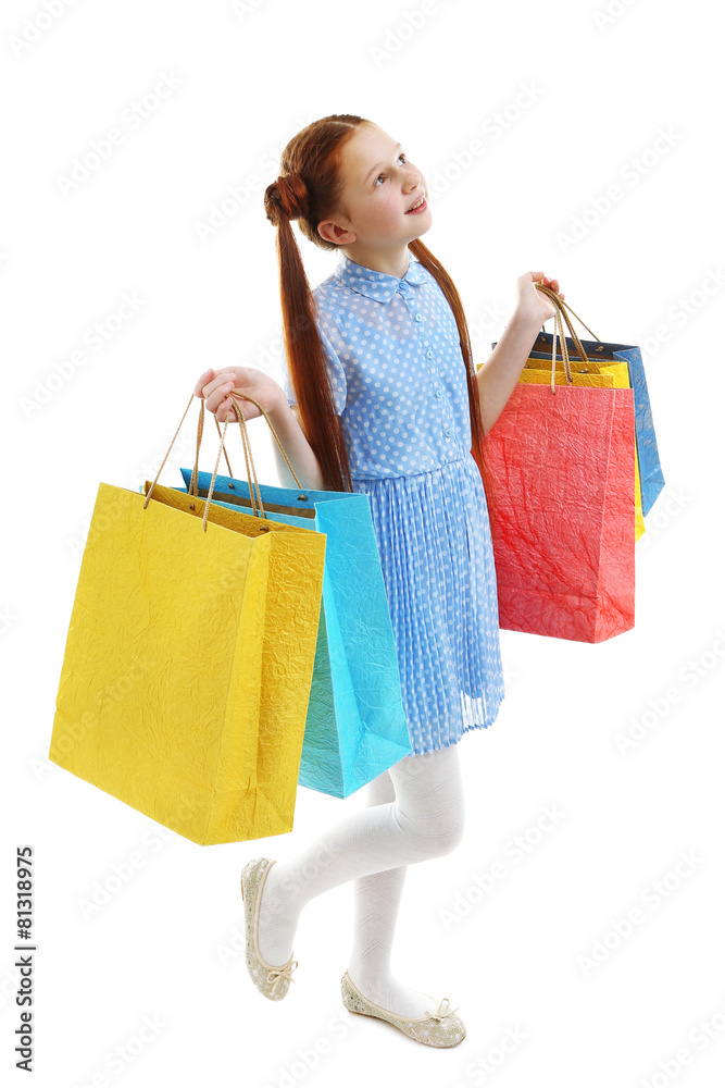 Beautiful little girl with shopping bags, isolated on white Beautiful little girl with shopping bags, isolated on white