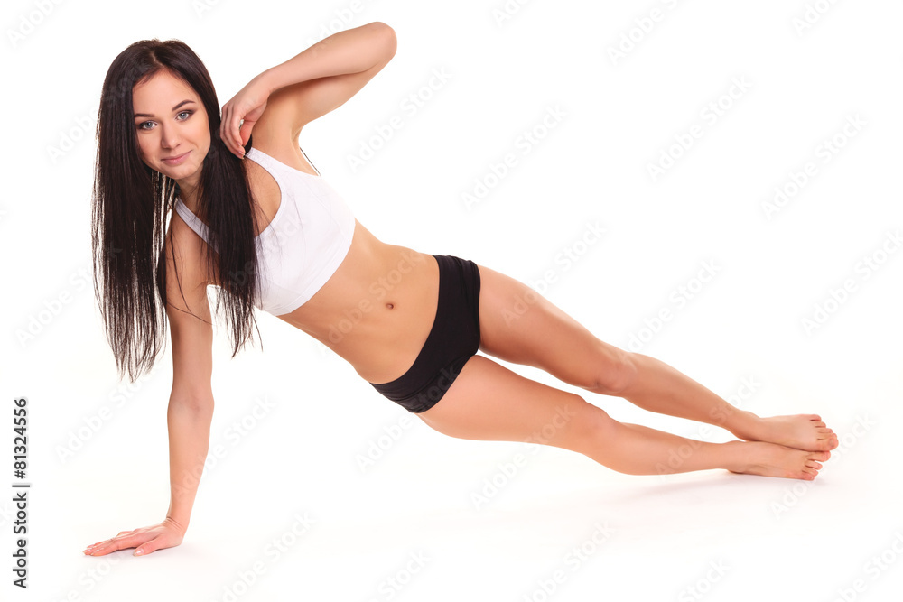 Beautiful young woman exercising in a fitness center - Pushup Beautiful young woman exercising in a fitness center - Pushup