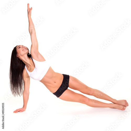 Beautiful young woman exercising in a fitness center - Pushup