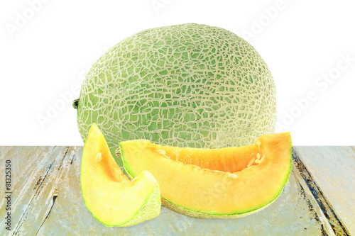 cantaloupe melon cut and whole in pure white background