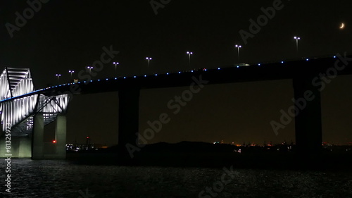 Transportation surrounding the illuminated Tokyo Gate Bridge