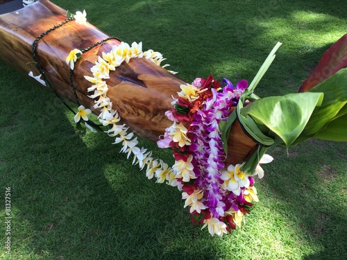 Outrigger canoe draped in flower lei, Oahu, Hawaii photo