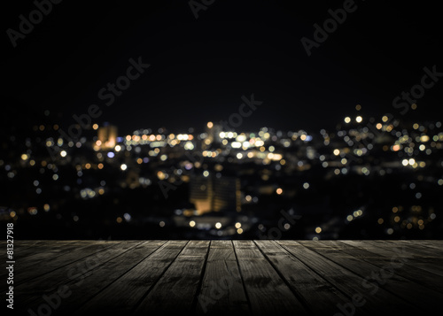 Wooden plank above phuket town at night © surasaki
