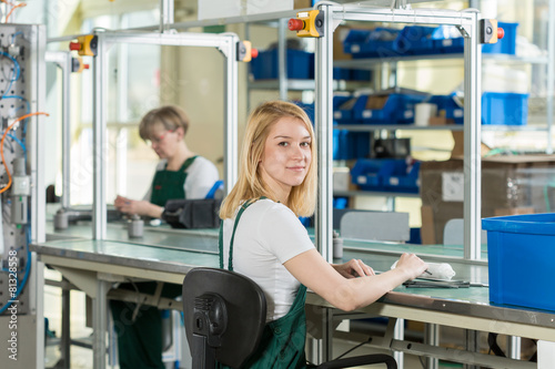 Woman working on production line photo